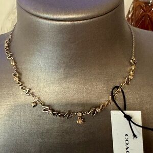 Coach Gold Script Necklace
